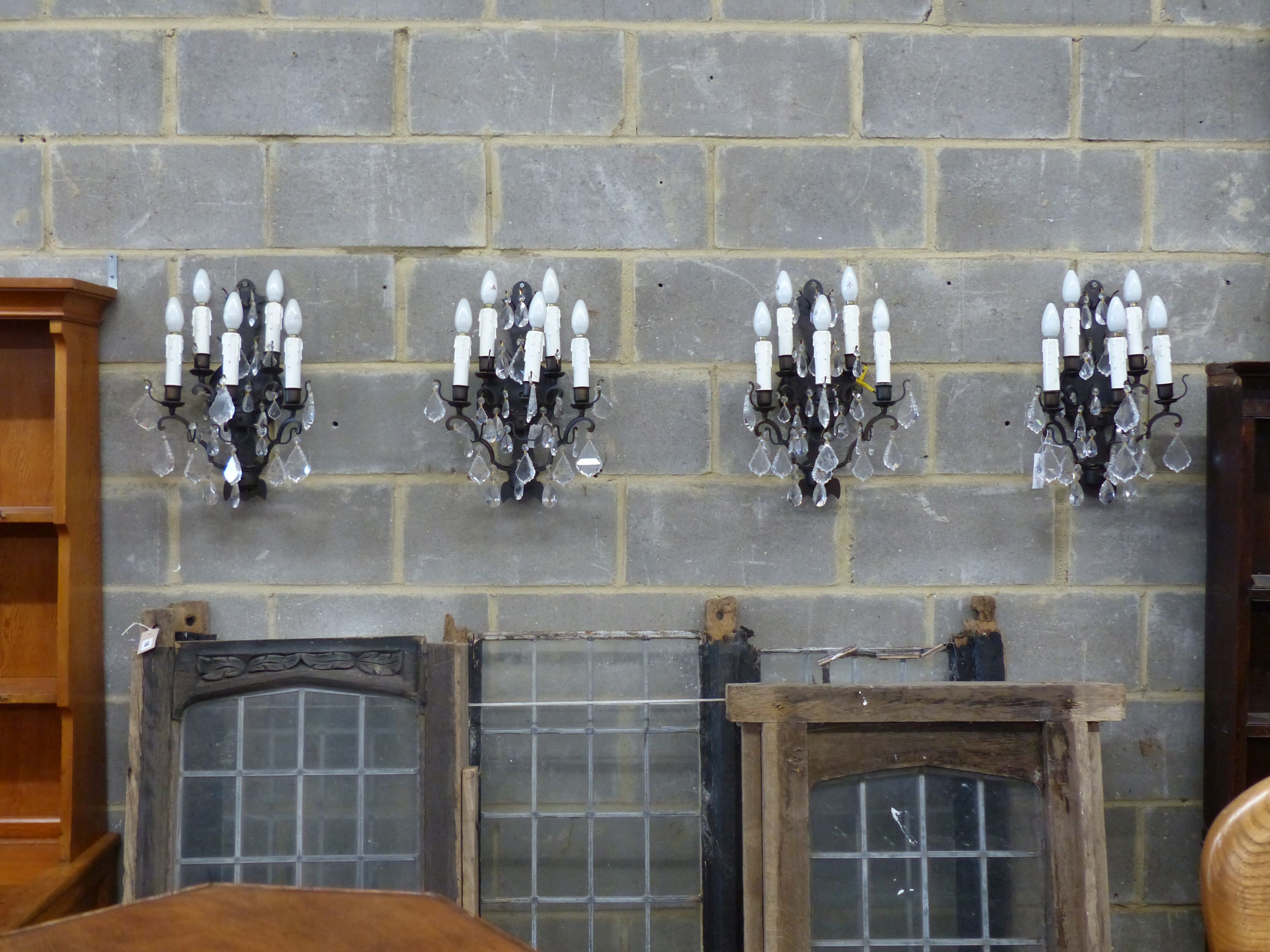 A set of six painted metal five branch wall lights, faceted glass drops, height 46cm